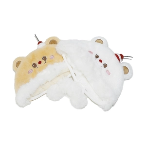 Detail of plush bear hat with 3D ears, cherry accent, and long chin straps for winter warmth