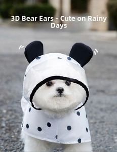 Close-up of waterproof polka dot pet raincoat with transparent brim and bear ears