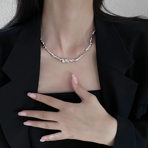 Minimalist silver irregular warped necklace with lava fluid texture on model