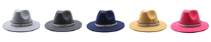 Flat lay of five colorful wool fedora hats with floral ribbon bands for autumn winter