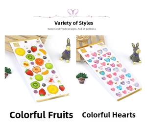 Detail of gold foil crystal stickers featuring fruit and heart patterns for DIY scrapbooking