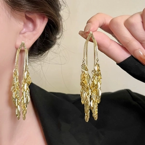 Elegant gold flower tassel earrings for women with dangling metal chains and sequin detail
