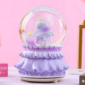Detailed view of the purple music box base and cute figure inside the crystal ball