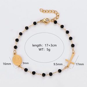 Gold and black beaded bracelet featuring Virgin Mary medal and Latin cross pendant
