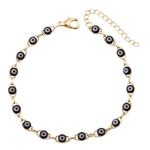 Minimalist gold chain bracelet with black and white evil eye beads and lobster clasp