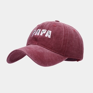 Detailed view of the PAPA embroidery with fishing hooks on the washed cotton baseball cap
