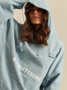 Oversize blue denim style hoodie featuring distressed holes and FOMO DEPT graphic print