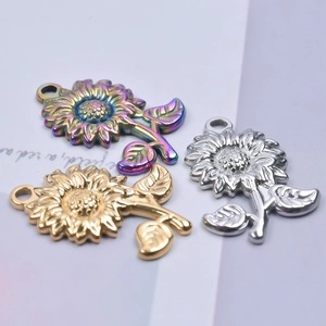 Detailed macro shot of sunflower pendants in rainbow, gold and silver stainless steel
