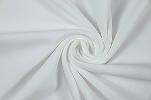 Macro detail of white pleated fabric texture with elegant drape and soft weave finish
