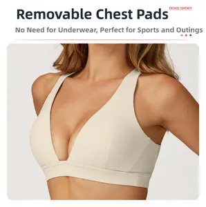 Detail view of the sports bra with removable padding and ivory matte fabric texture