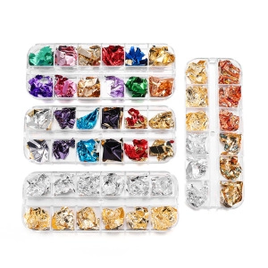 Flat lay of colorful nail art foil flakes in a transparent multi-grid storage box