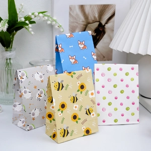 Mini colorful animal print paper gift bags with corgi, sheep, and bee patterns