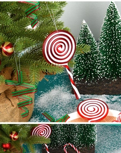Close-up of red and green swirl candy ornaments hanging on a snowy Christmas tree branch