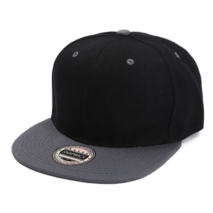 Detail view of a two-tone snapback baseball cap with black crown and grey flat brim
