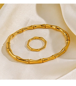 Detailed view of 18K gold plated stainless steel bamboo style bracelet and ring set
