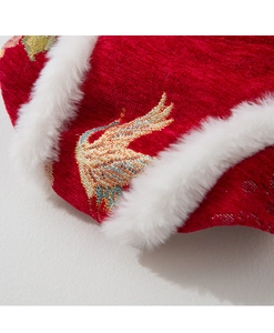 Detail of red Chinese style pet clothing with golden bird embroidery and white faux fur trim
