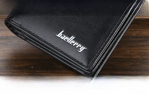 Close-up of hot stamping logo and premium leather texture on men's vertical wallet
