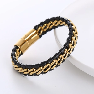 Macro detail of men's leather braided bracelet with gold stainless steel chain and magnetic clasp