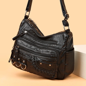 Black woven PU leather crossbody bag with multi-zipper pockets and metal ring decor