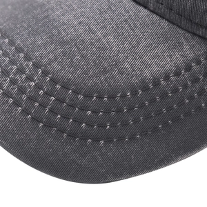 Detailed close-up of parallel stitching on the vintage washed dark gray baseball cap brim