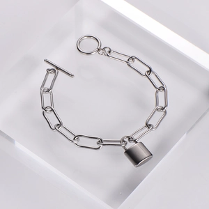 Silver metal chain bracelet with heart-shaped lock pendant and OT toggle clasp on cube