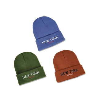 Stylish knitted beanies with New York embroidery in blue, green and caramel colors