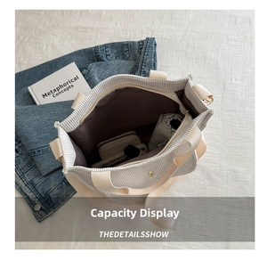 Detailed internal view of beige corduroy tote bag showing large capacity and zipper closure