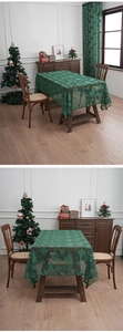 Detailed pattern of green Christmas lace tablecloth with snowflake and reindeer motifs