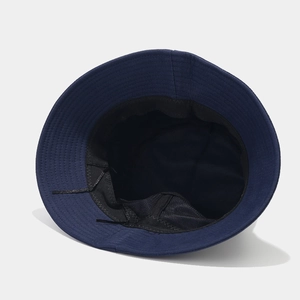 Navy blue cotton bucket hat featuring interior sweatband and adjustable drawstring