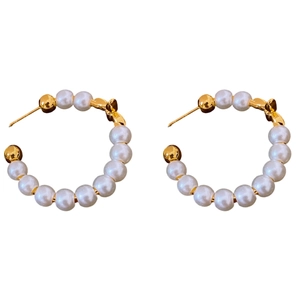 Elegant C-shape gold-plated earrings with pearls on white background