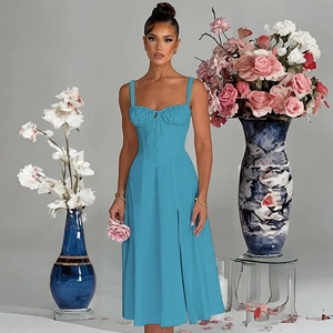 Detail of blue high-waist maxi dress with spaghetti straps and ruched bodice details