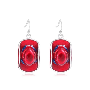 Close-up of red cowboy hat earrings with blue glitter details and silver hooks