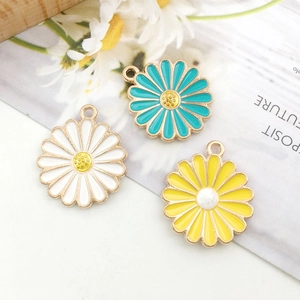 Three colorful daisy enamel charms with gold frames and pearl centers for DIY jewelry making