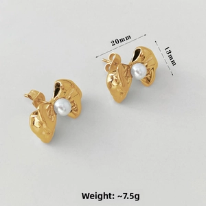 Detailed view of gold bow earrings with pearls showing 20mm width and 13mm height dimensions