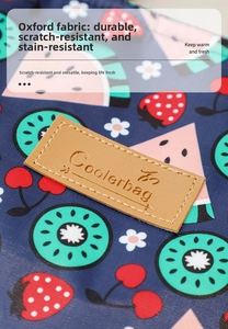 Close-up of durable navy oxford fabric and brown leather label on insulated cooler bag