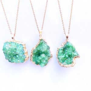 Irregular green crystal cluster pendants with gold plated edges on fine chain necklaces
