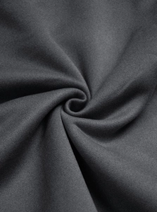 Close-up detail of dark grey knitted fabric showing soft texture and premium cotton blend