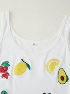 Detail of white ribbed tank top with sequined strawberry and lemon embroidery