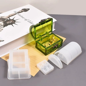 Detail view of transparent resin treasure chest made from DIY silicone mold with coins