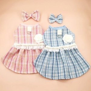 Pink and blue tweed pet dresses with pearl accents, lace trim, and matching hair bows