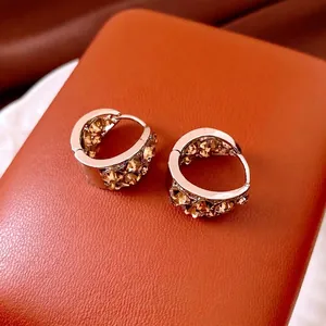 Orecchini vintage a U color argento con micro-incastonatura di cristalli ambrati retrò