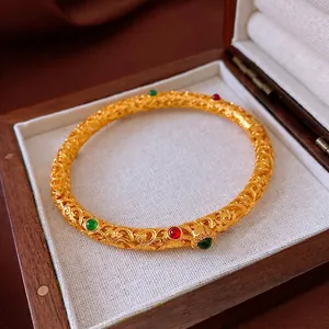 24K gold plated filigree bangle with red and green gemstones in vintage oriental style
