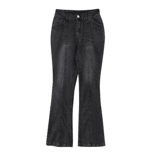 Close-up of vintage dark grey flared denim jeans with vertical double stitching detail
