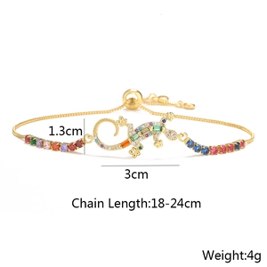 Detail view of gecko-shaped bracelet in gold plating with colorful zircon stones