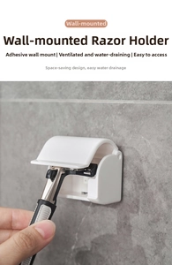 Close-up of a wall-mounted razor holder made of white plastic with adhesive back