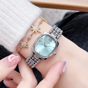 Elegant ladies square silver watch with light green dial and gold star bracelet