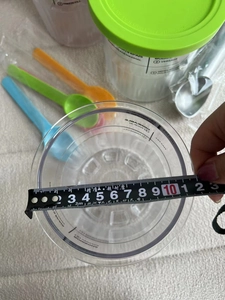 Detail shot showing 11.5cm diameter measurement of Ninja Creami NC501 series storage pint