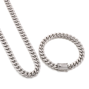 Polished silver Cuban link chain necklace and bracelet set with sparkling diamond accents