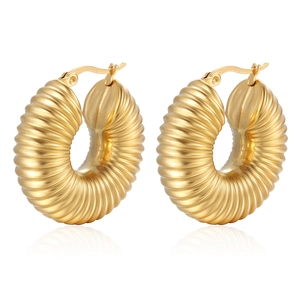 Detail of 18K gold plated hollow earrings featuring a spiral croissant twisted texture