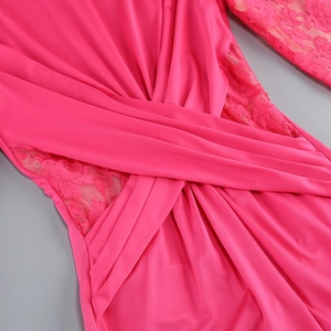 Detailed view of magenta long sleeve dress with lace texture and twisted knot design